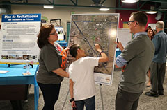 people looking at map of revitalization plan