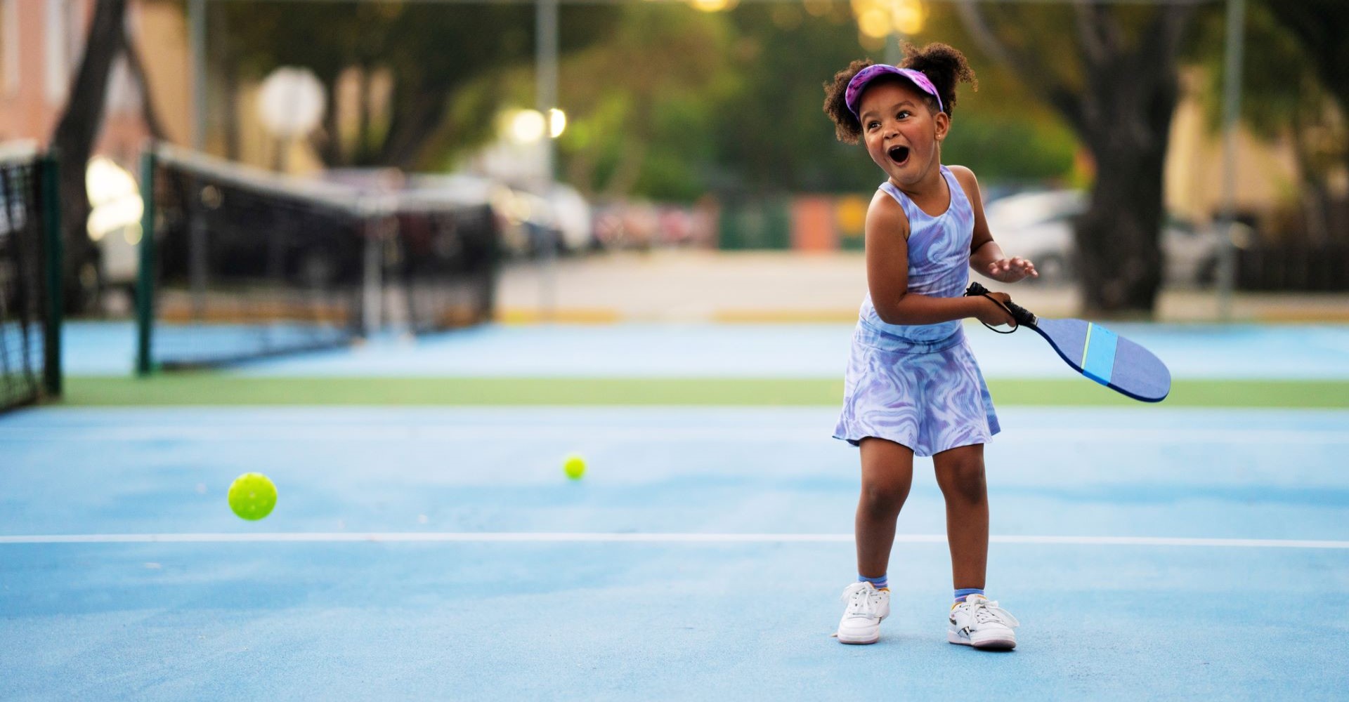 Outdoors Pickleball Court with little girl.