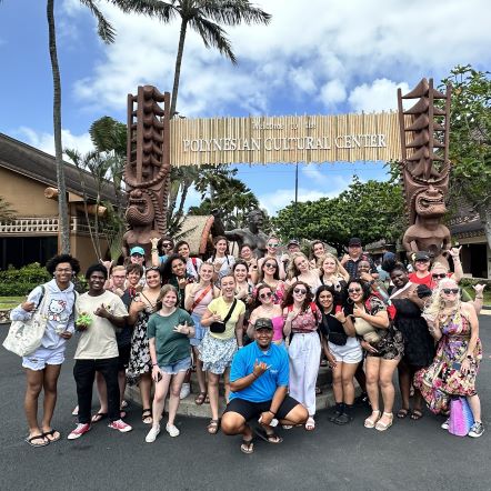 Pinecrest Cadence Show Choir smiling for the National Veterans Day parade in Honolulu, HI.