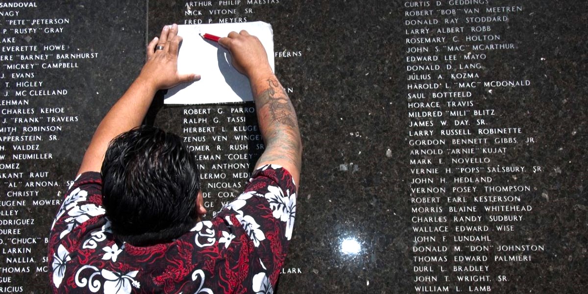 Honoring veteran at Veteran Memorial Wall.