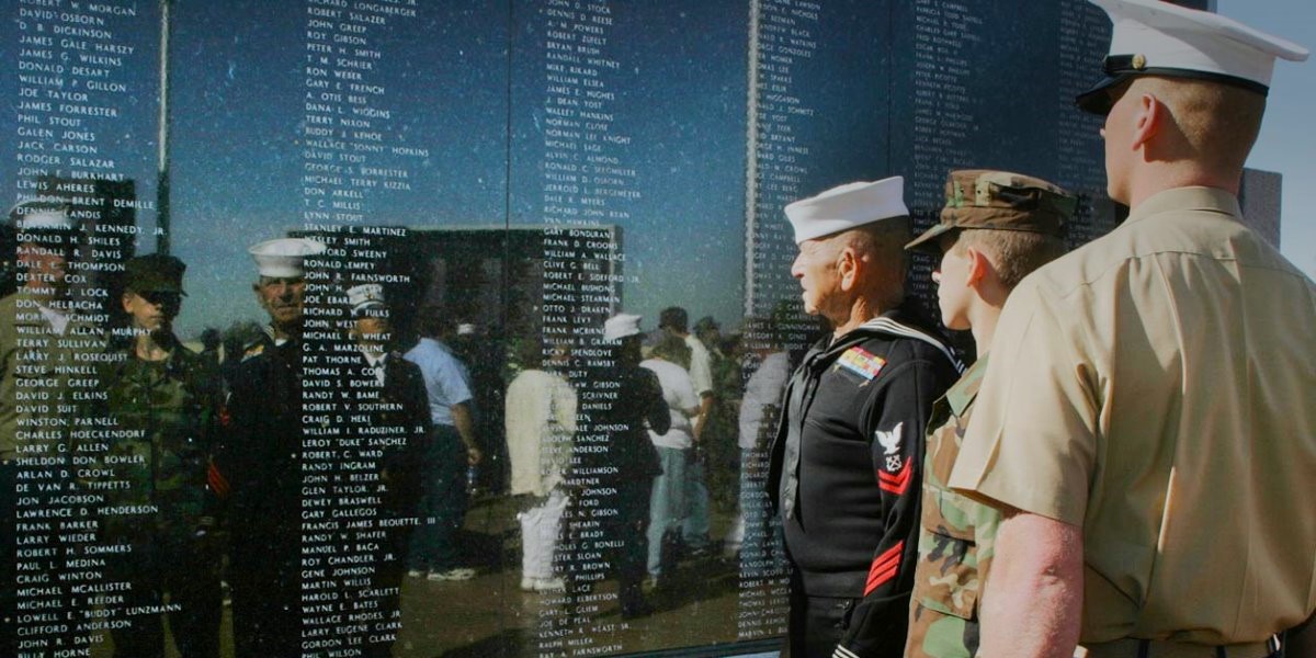 Residents honor veterans at Veteran Memorial Wall.