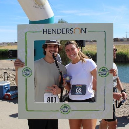 Earth Day Recycled 5k Run participants smiling with medals.