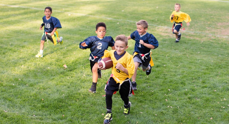 Youth playing flag football