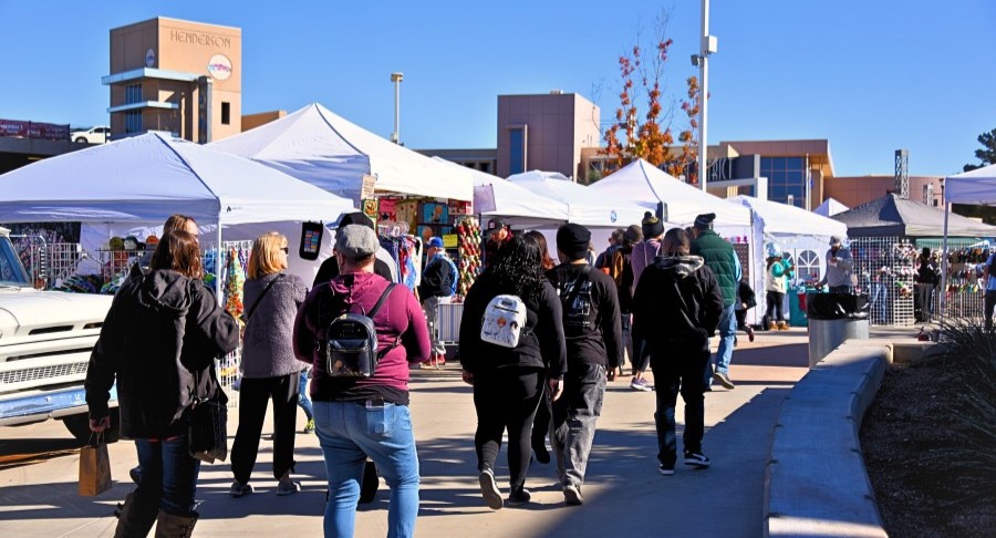 Shop Small Saturday vendors tents and residents browsing.