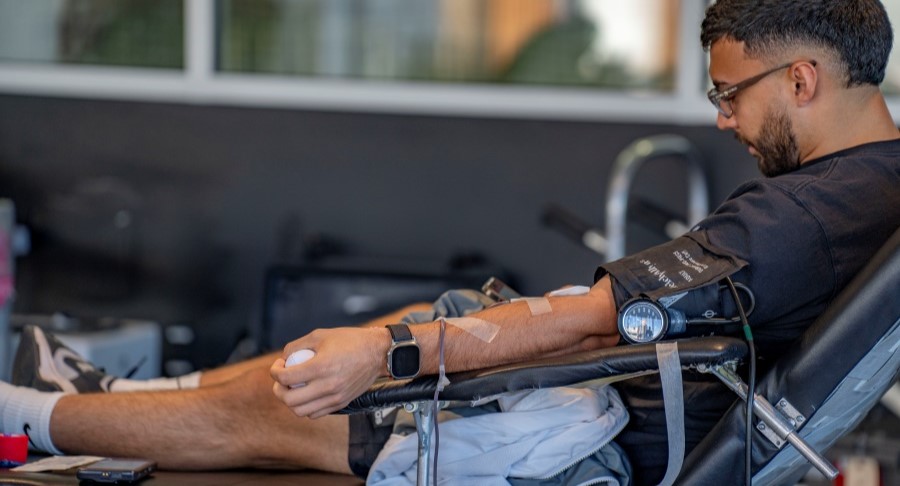 Resident donating blood at Henderson Blood Drive.